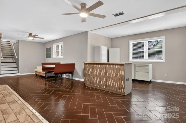a living room with furniture and a window