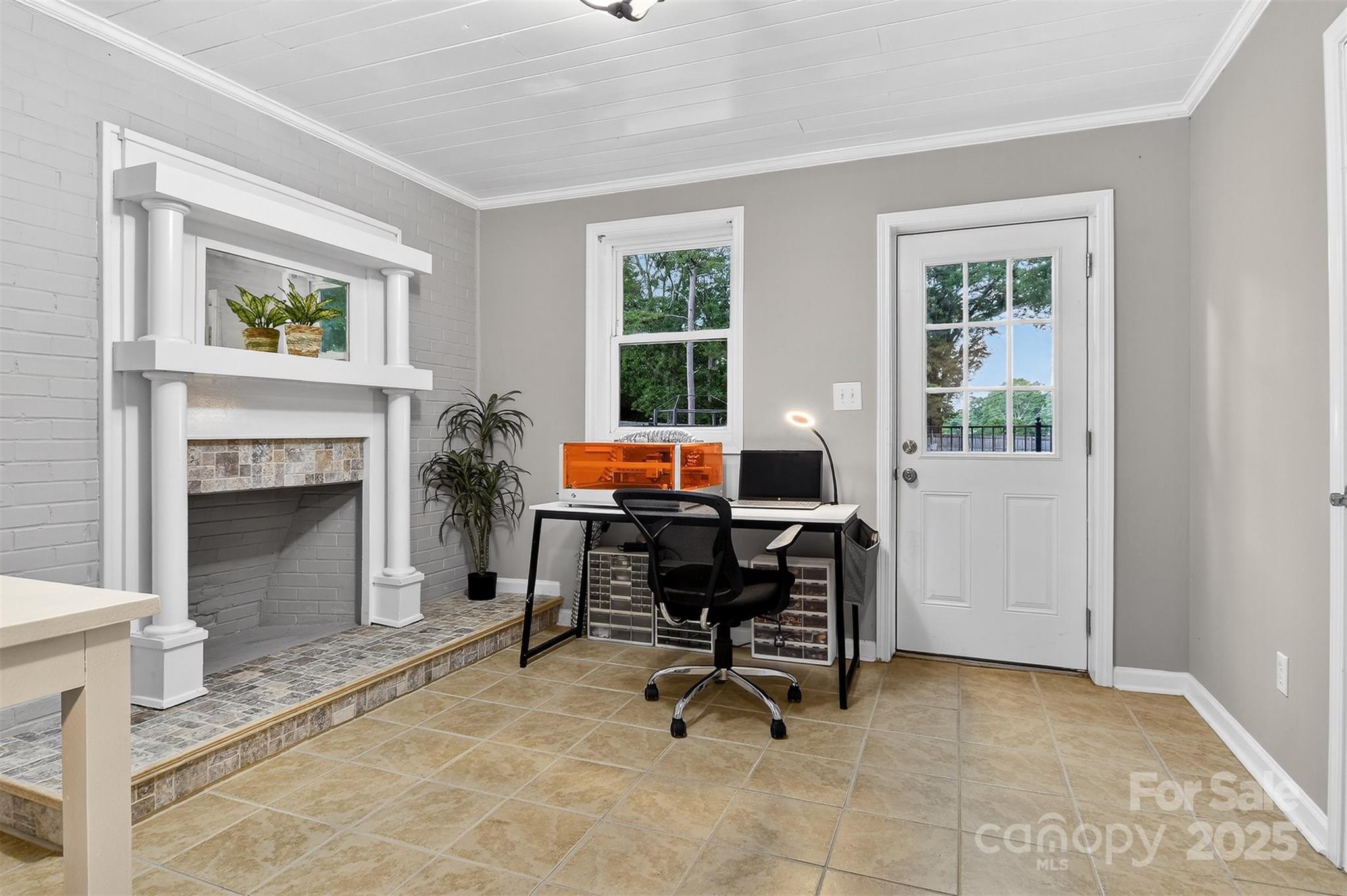 3127 North Center Street Hickory, NC 28601 - Photo 32 of 47 a workspace with a fireplace and a window