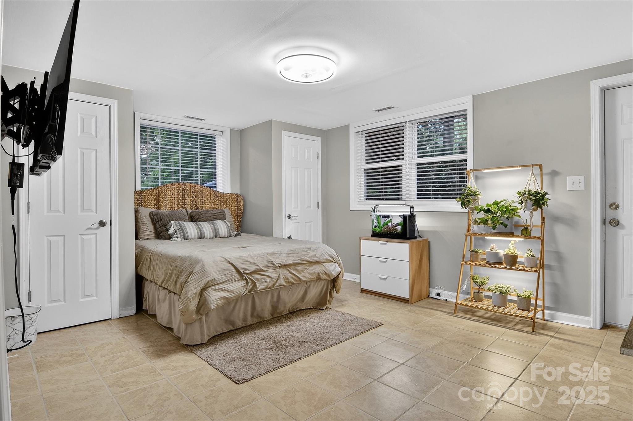 3127 North Center Street Hickory, NC 28601 - Photo 33 of 47 a bedroom with a bed and a potted plant