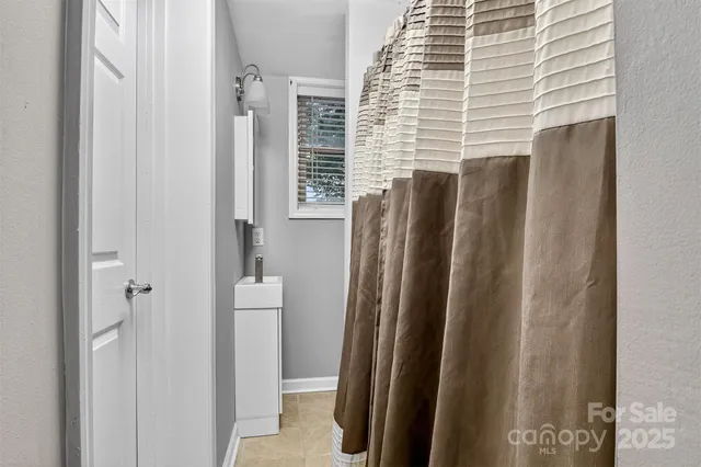 a view of closet with wooden floor
