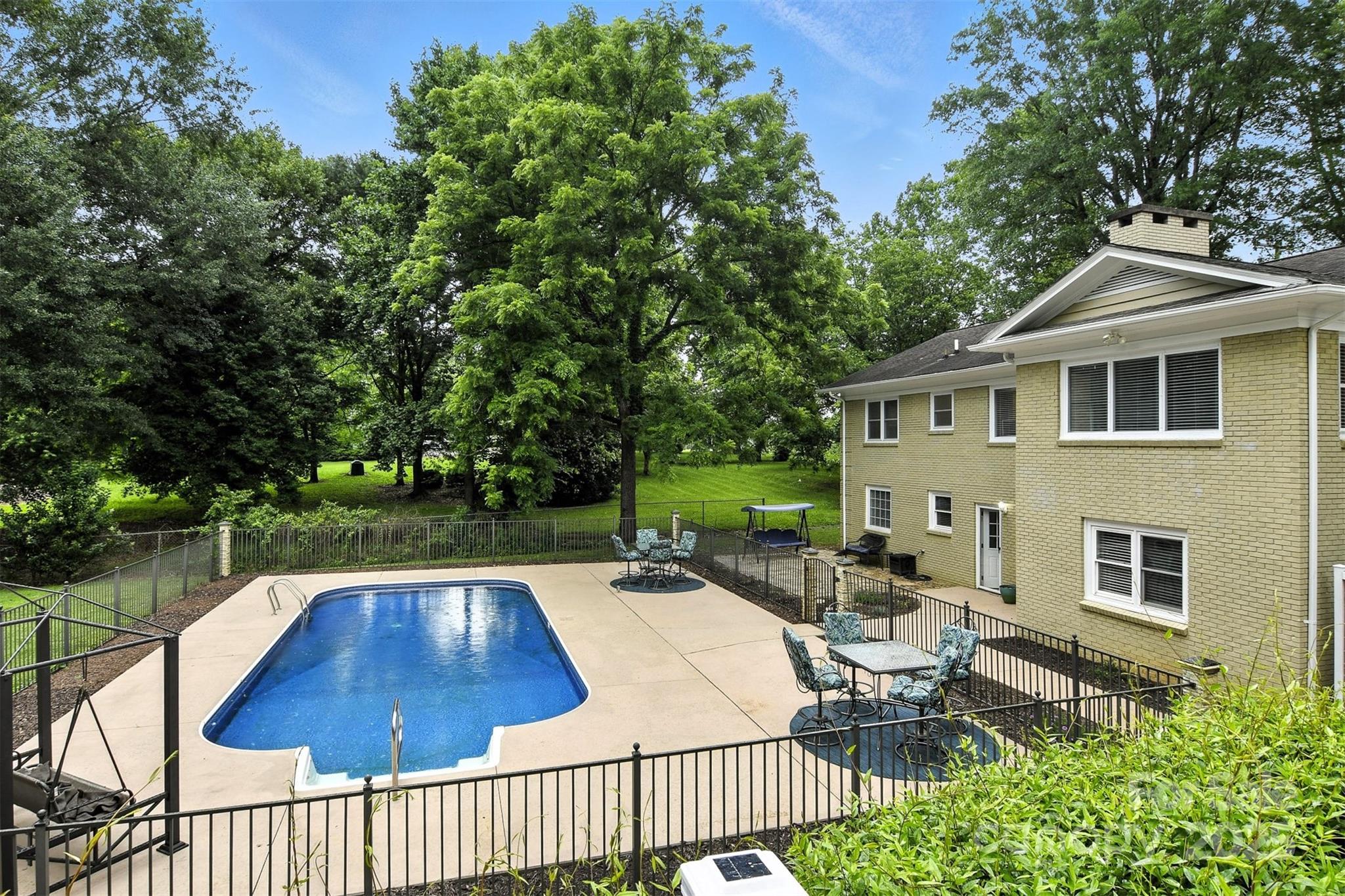 3127 North Center Street Hickory, NC 28601 - Photo 38 of 47 a view of a patio with table and chairs with wooden floor and fence