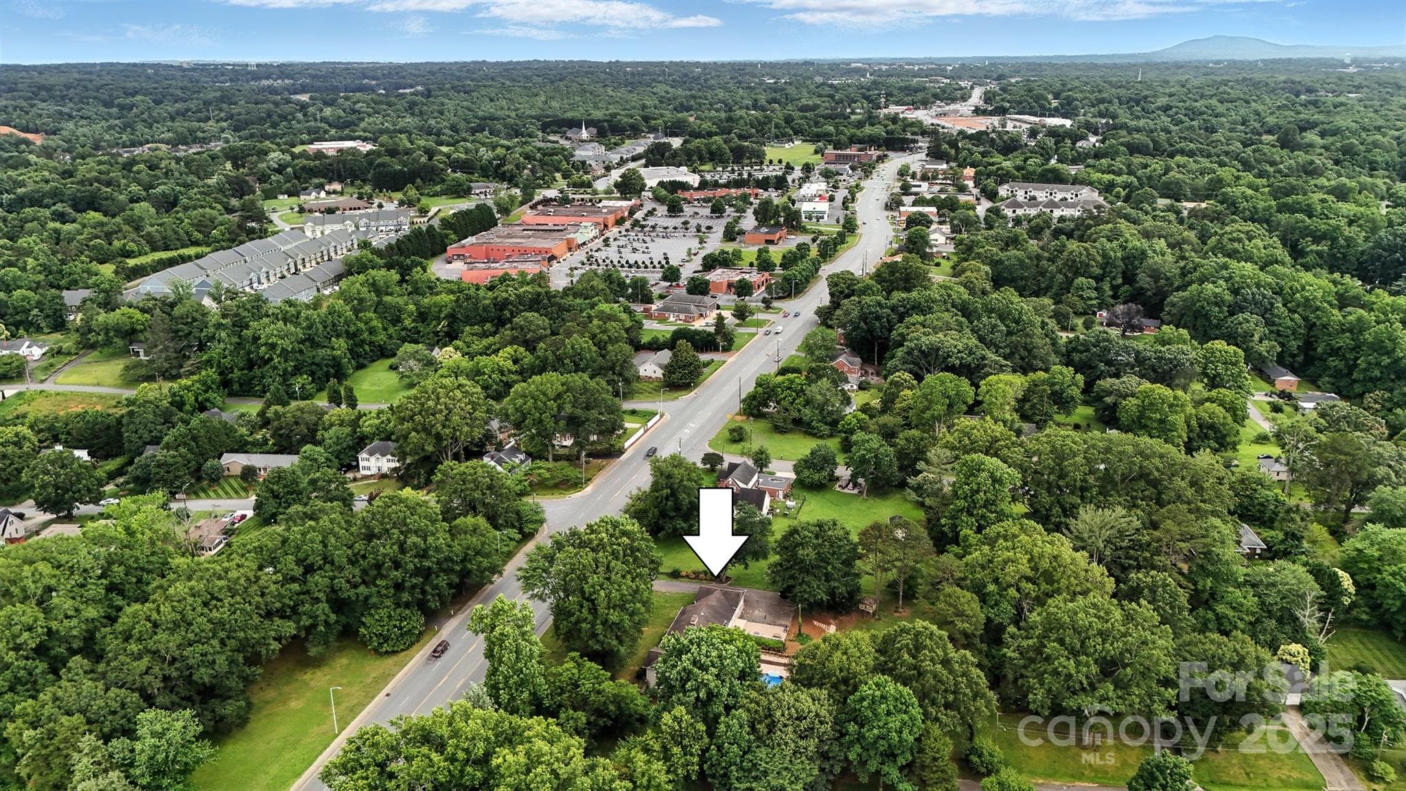 3127 North Center Street Hickory, NC 28601 - Photo 46 of 47 an aerial view of residential houses with outdoor space and trees