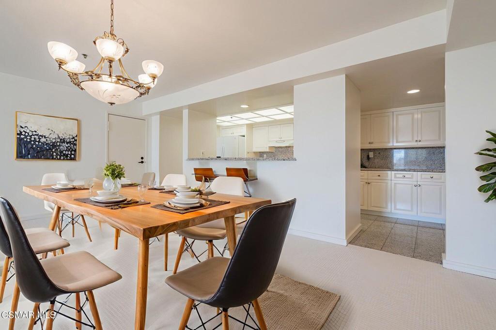 10660 Wilshire Boulevard, Unit 410 Los Angeles, CA 90024 - Photo 11 of 85 a dining room filled chandelier and wooden floor