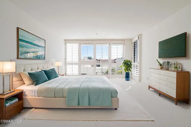 a view of a kitchen with a sink and a chandelier
