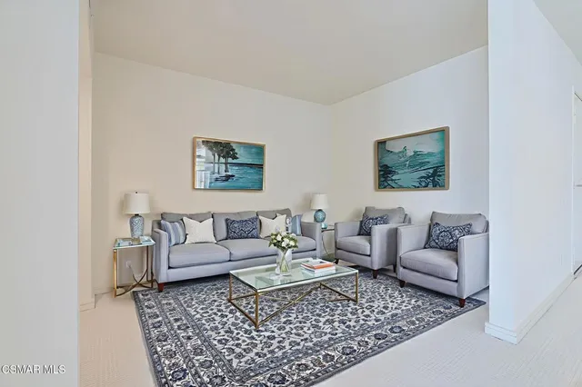 a view of a big room with a kitchen