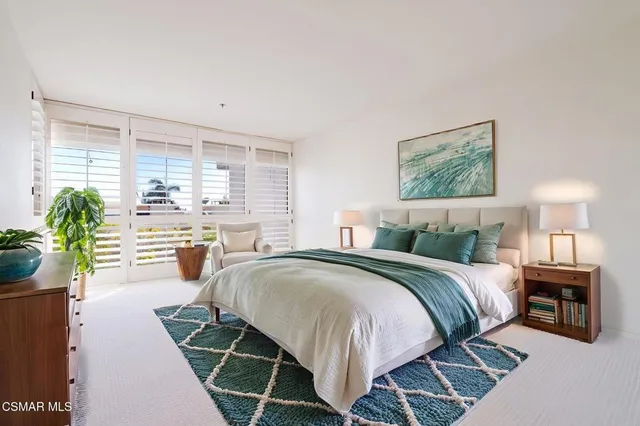 a view of a kitchen with a sink and a refrigerator
