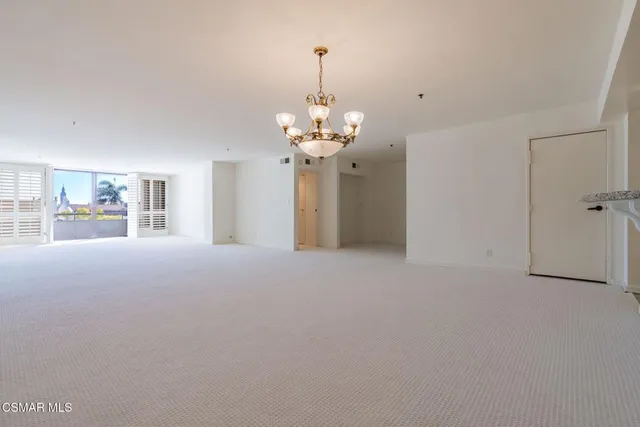 a kitchen with stainless steel appliances a sink stove and cabinets