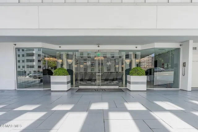 a view of a lobby with furniture and floor to ceiling window