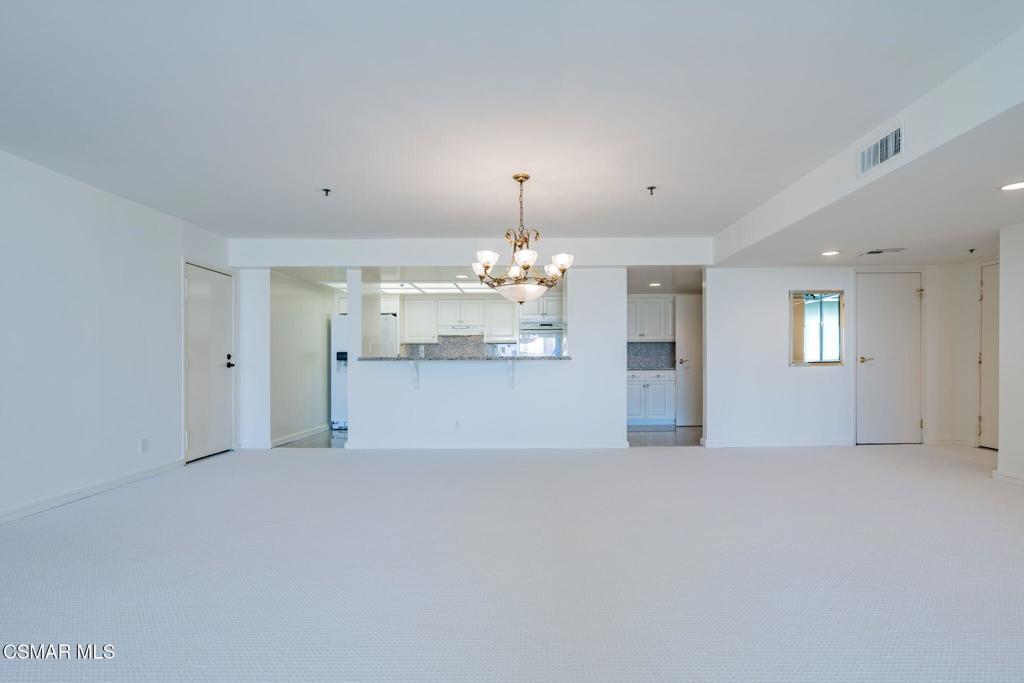 10660 Wilshire Boulevard, Unit 410 Los Angeles, CA 90024 - Photo 21 of 85 a view of a kitchen with a sink and a chandelier