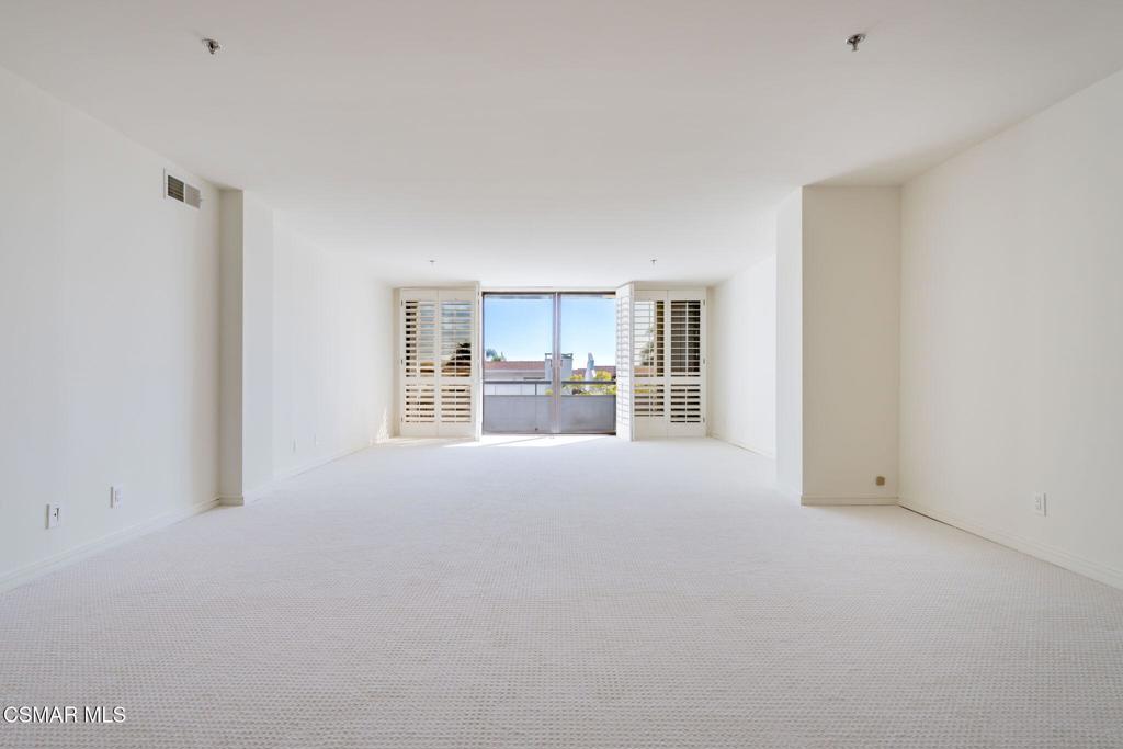 10660 Wilshire Boulevard, Unit 410 Los Angeles, CA 90024 - Photo 23 of 85 a view of a kitchen with a sink and a refrigerator