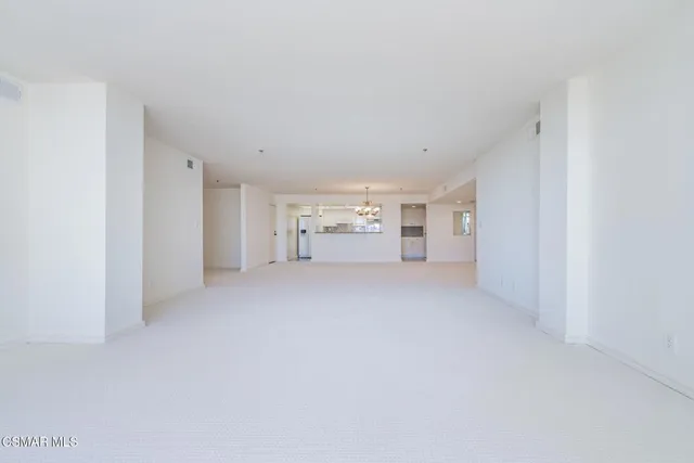 a bathroom with a granite countertop sink mirror and a bath tub