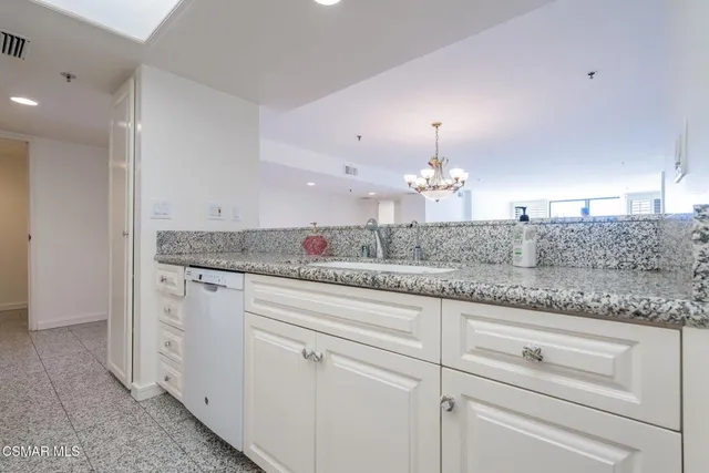 a bathroom with a toilet sink and shower