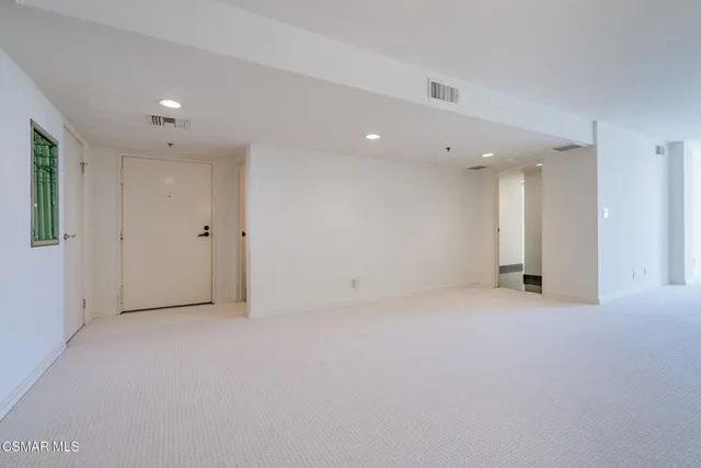 a view of a hallway with closet