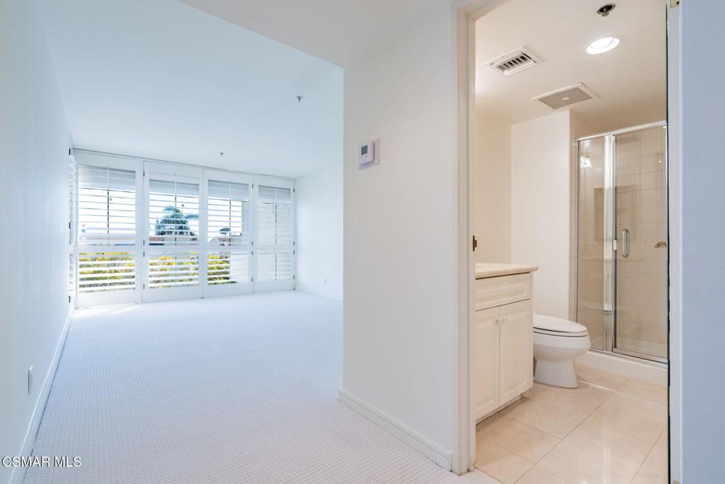 10660 Wilshire Boulevard, Unit 410 Los Angeles, CA 90024 - Photo 57 of 85 a bathroom with a toilet sink and shower