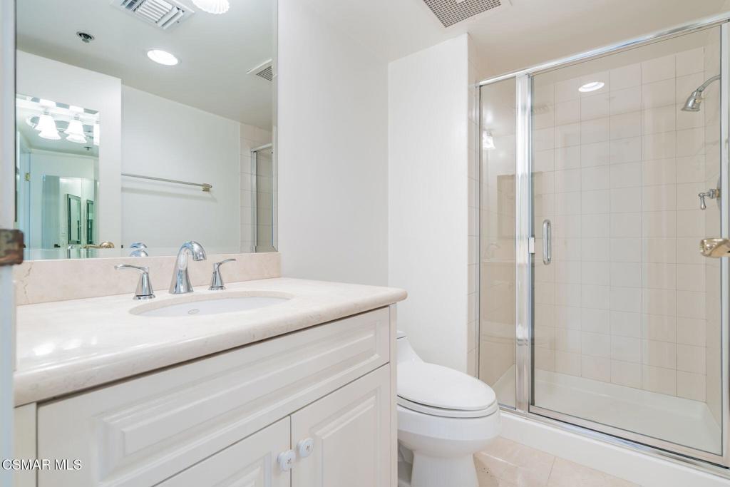10660 Wilshire Boulevard, Unit 410 Los Angeles, CA 90024 - Photo 61 of 85 a bathroom with a sink a toilet and shower