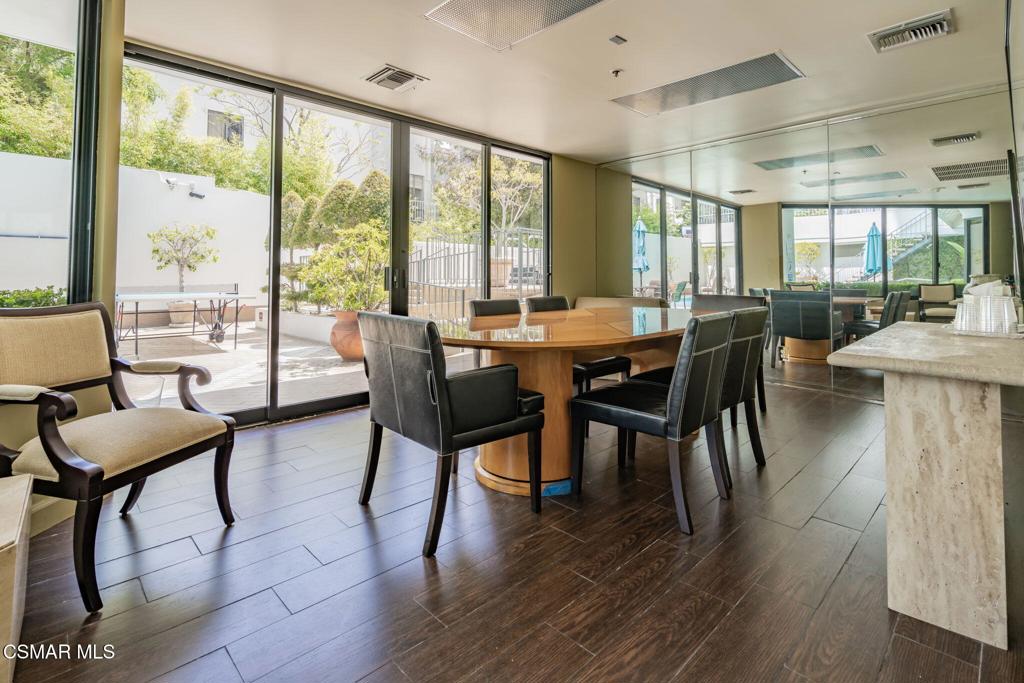 10660 Wilshire Boulevard, Unit 410 Los Angeles, CA 90024 - Photo 79 of 85 a view of a dining room with furniture and wooden floor