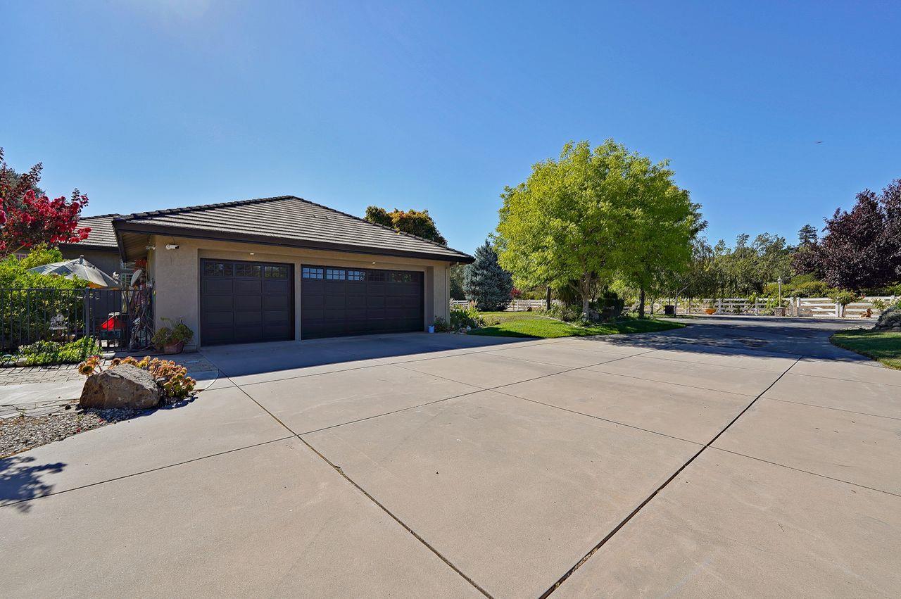 5000 Hecker Pass Road Gilroy, CA 95020 - Photo 48 of 100 a front view of a house with garden