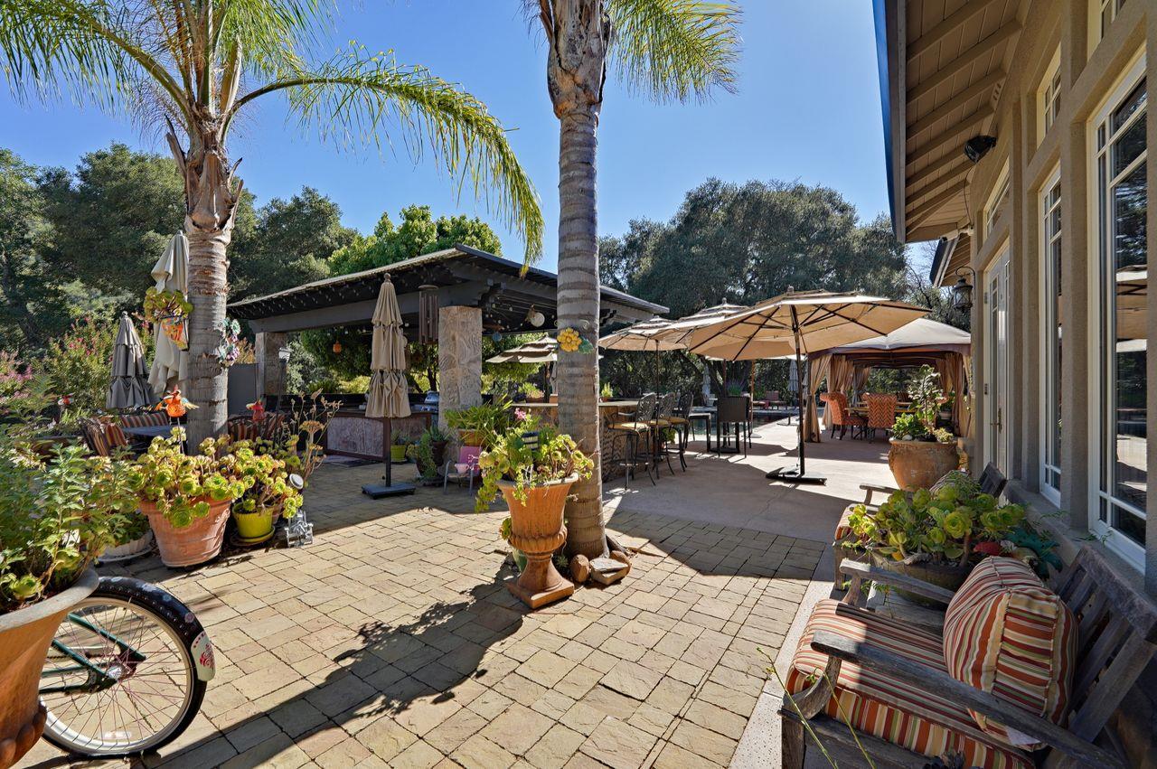 5000 Hecker Pass Road Gilroy, CA 95020 - Photo 50 of 100 a view of a patio with furniture and a umbrella