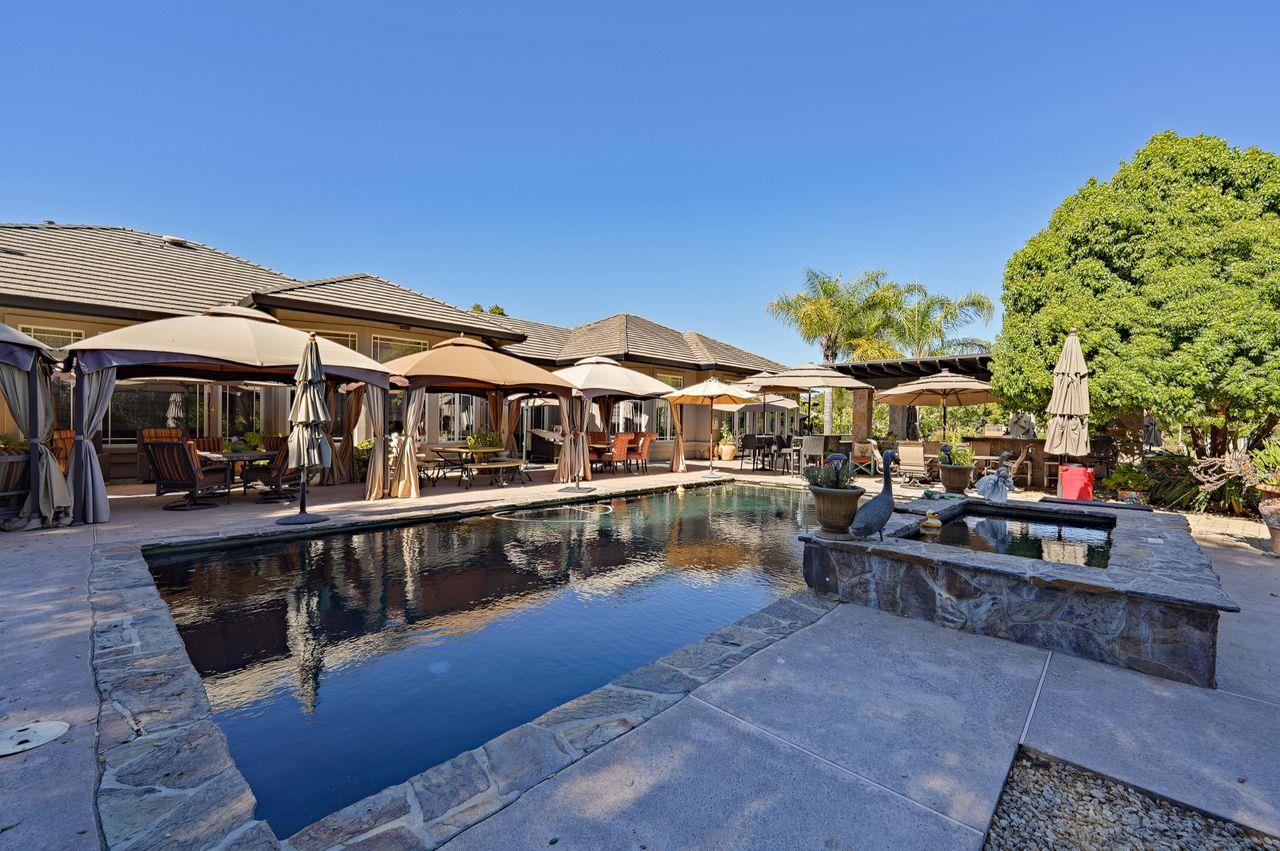 5000 Hecker Pass Road Gilroy, CA 95020 - Photo 59 of 100 a view of a swimming pool with a lounge chairs