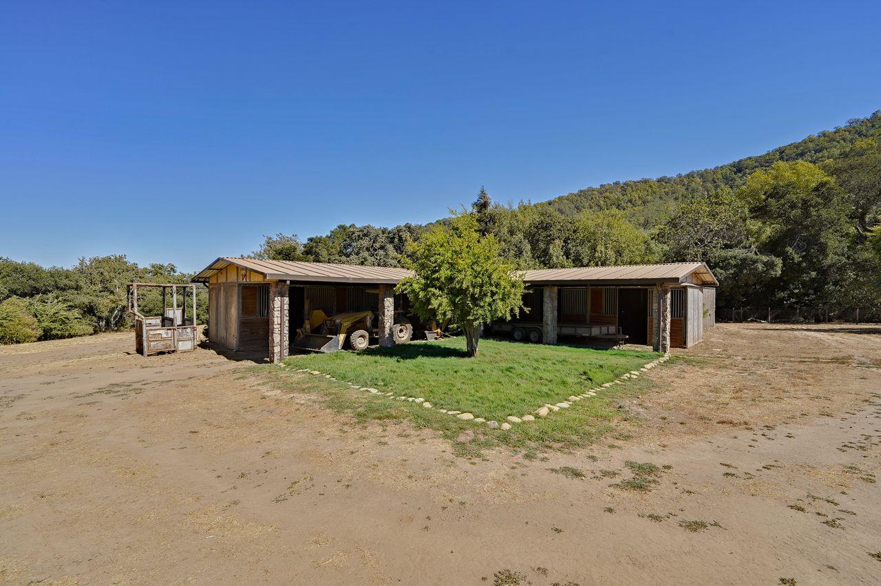 5000 Hecker Pass Road Gilroy, CA 95020 - Photo 70 of 100 a front view of a house with a yard and garage
