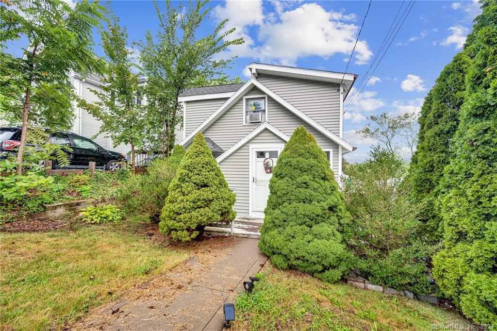 8 Carle Road Branford, CT 06405 - Photo 1 of 1 a view of a house with a yard and plants