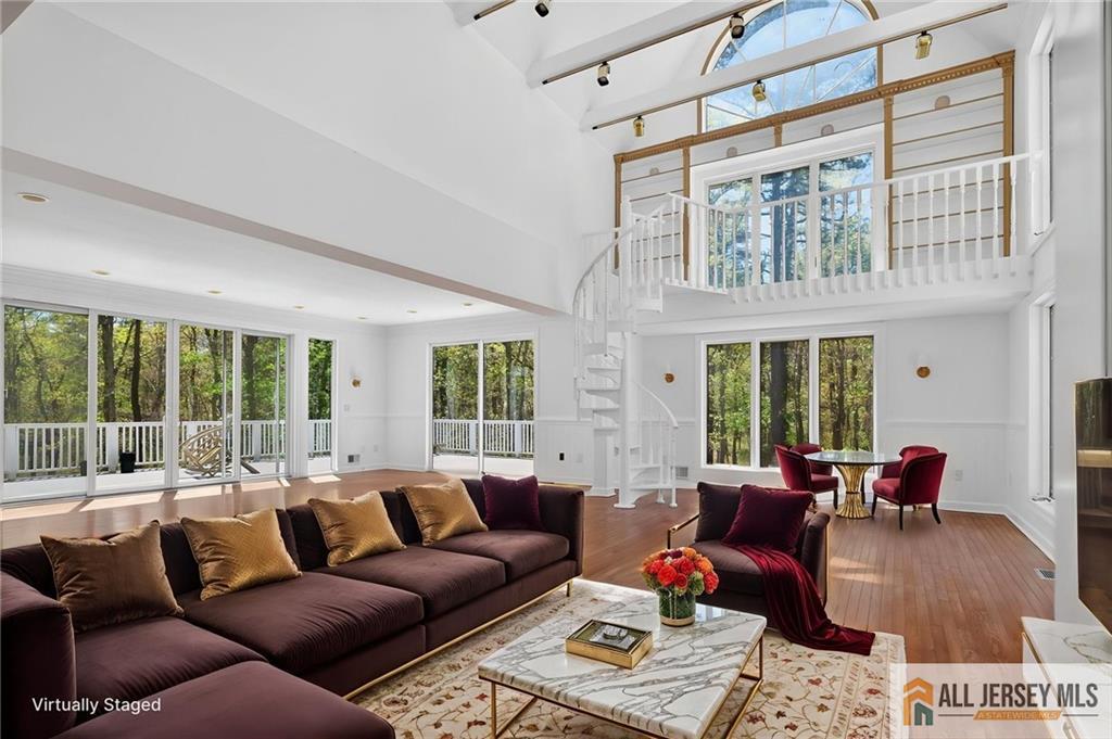 381 Monmouth Road Freehold, NJ 07728 - Photo 61 of 63 a living room with furniture ceiling fan and a window
