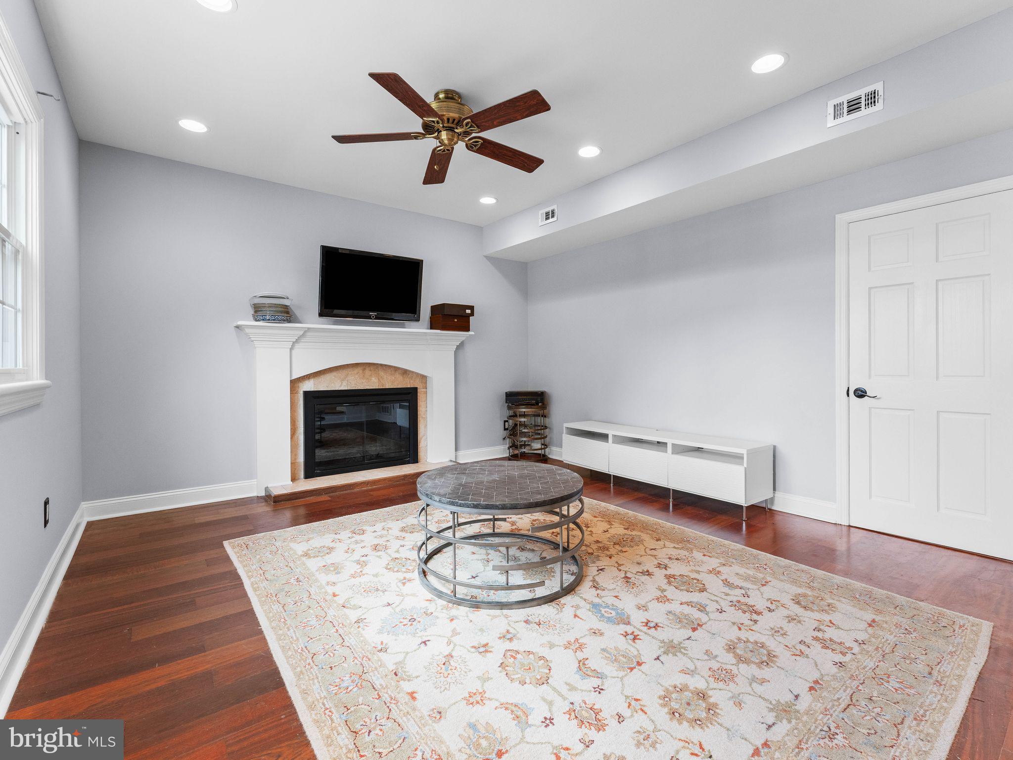8 Chesterfield Road Sewell, NJ 08080 - Photo 18 of 57 a living room with furniture and a fireplace