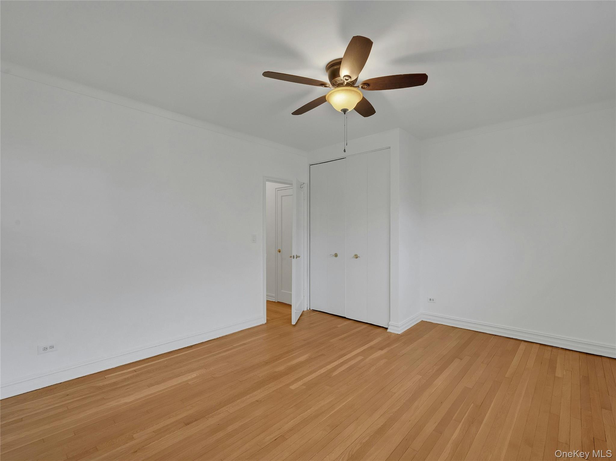 764 Palmer Road, Unit 1B Bronxville, NY 10708 - Photo 16 of 29 wooden floor in an empty room