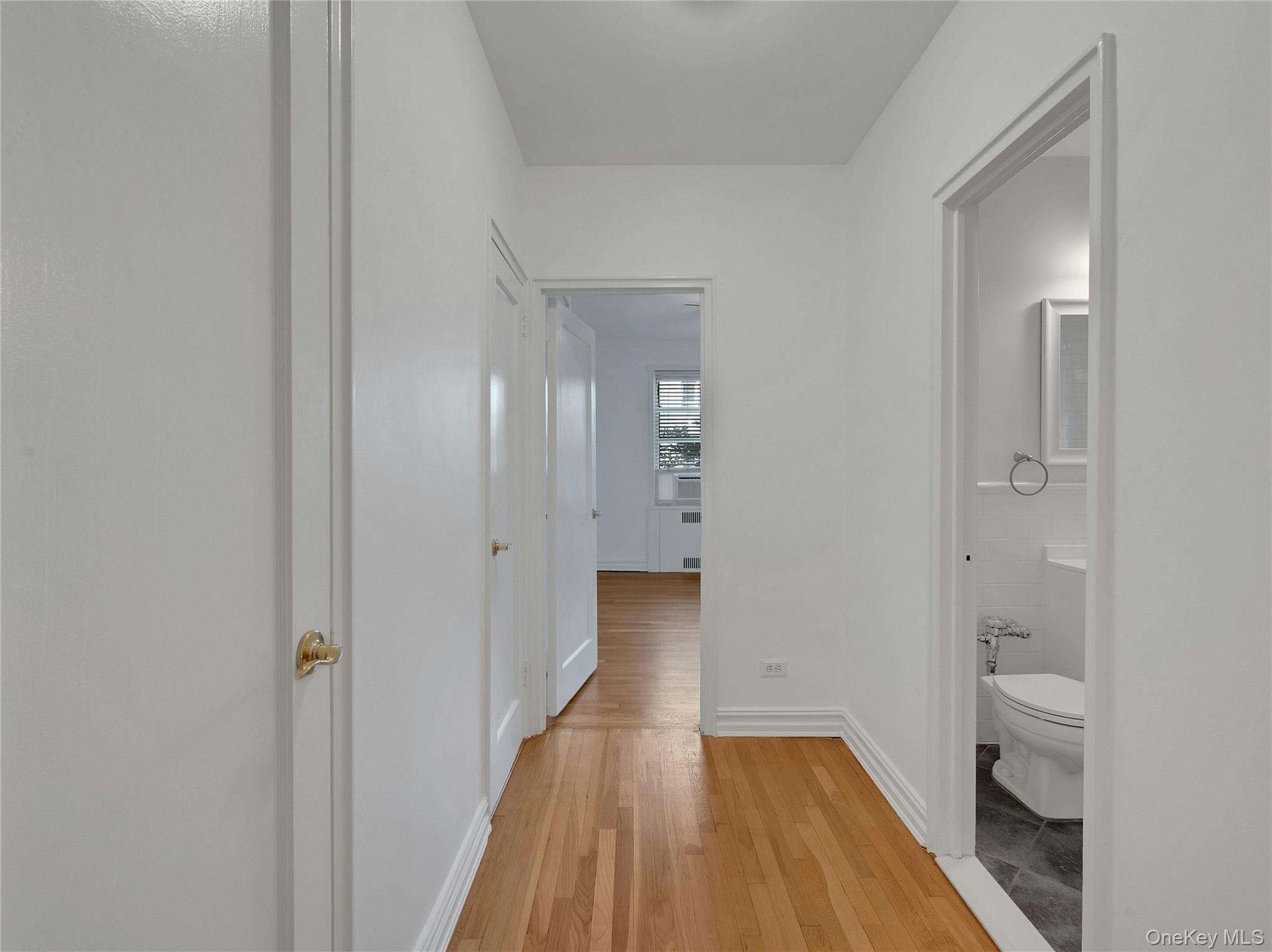 764 Palmer Road, Unit 1B Bronxville, NY 10708 - Photo 19 of 29 a view of a room with wooden floor and a bathroom