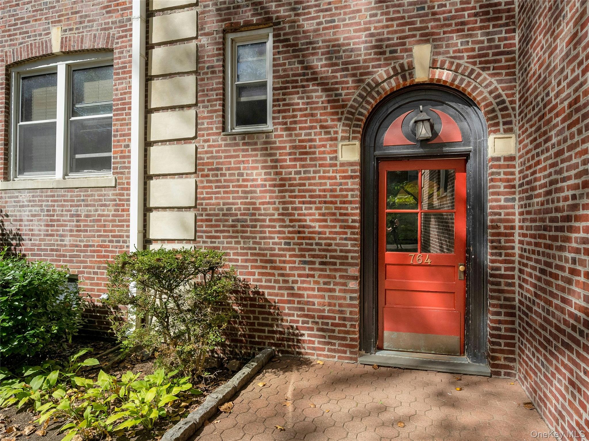 764 Palmer Road, Unit 1B Bronxville, NY 10708 - Photo 2 of 29 a view of a brick house with a large windows