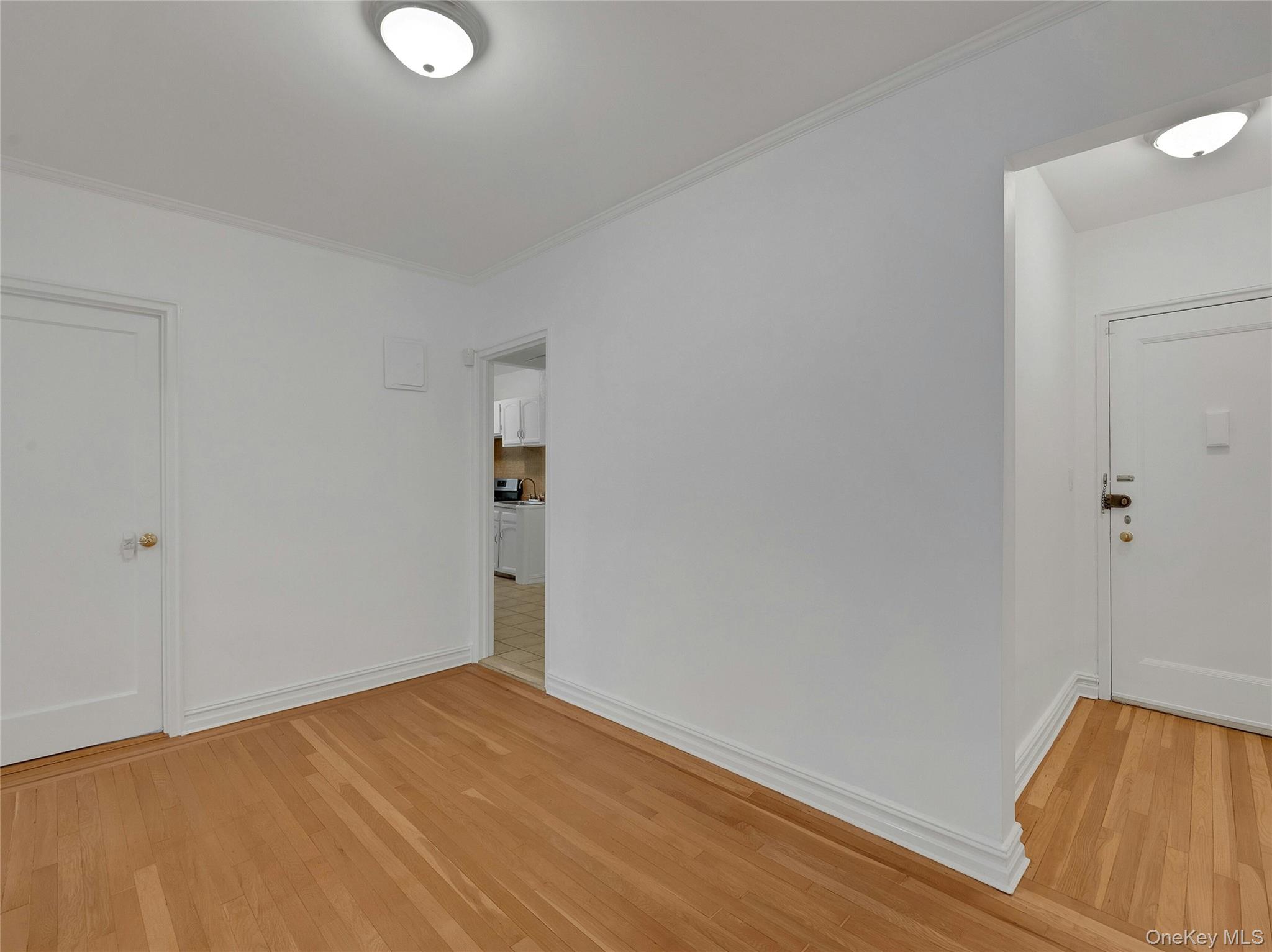 764 Palmer Road, Unit 1B Bronxville, NY 10708 - Photo 23 of 29 a view of a room with wooden floor and white walls