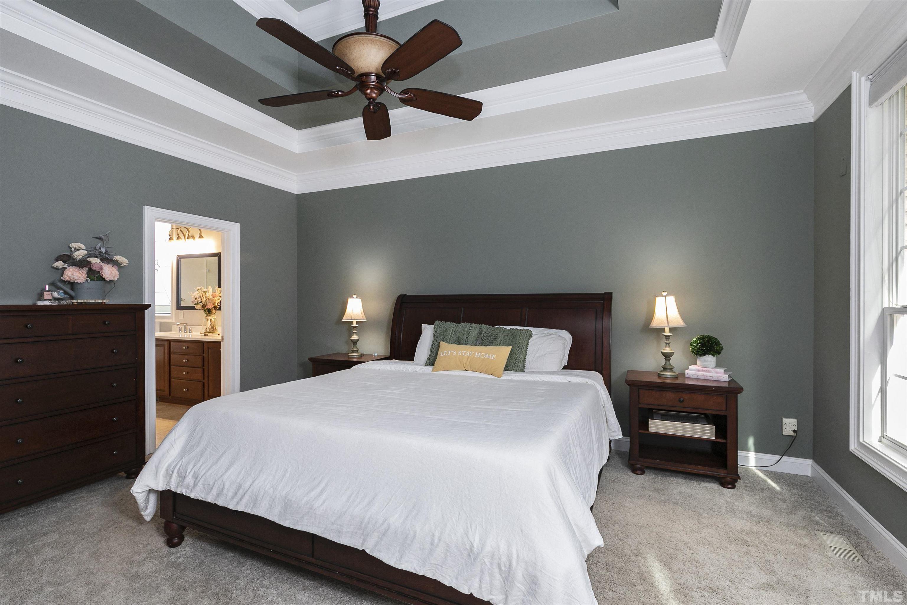 2255 Clayette Court Raleigh, NC 27612 - Photo 23 of 59 a bedroom with a bed and a lamp on dresser