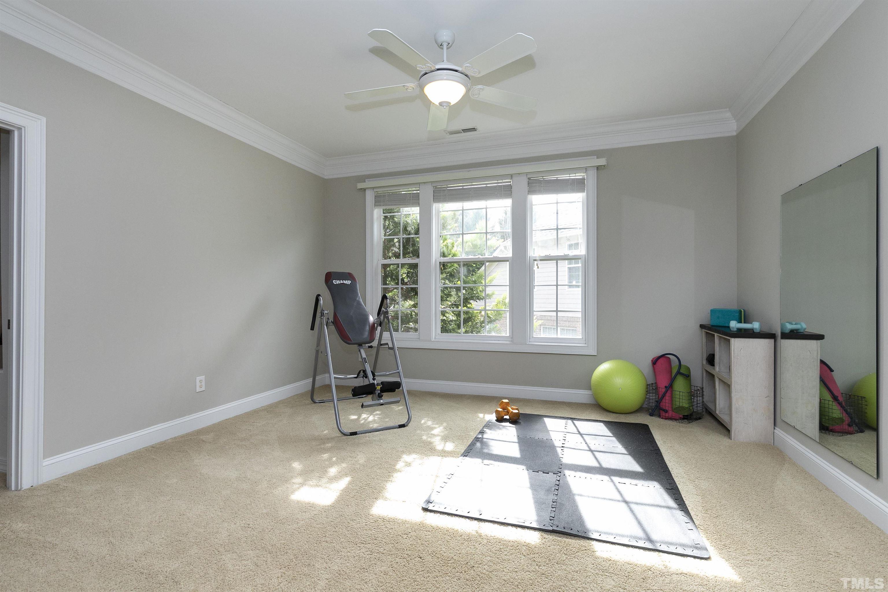 2255 Clayette Court Raleigh, NC 27612 - Photo 35 of 59 a very nice looking room with a window and gym equipment