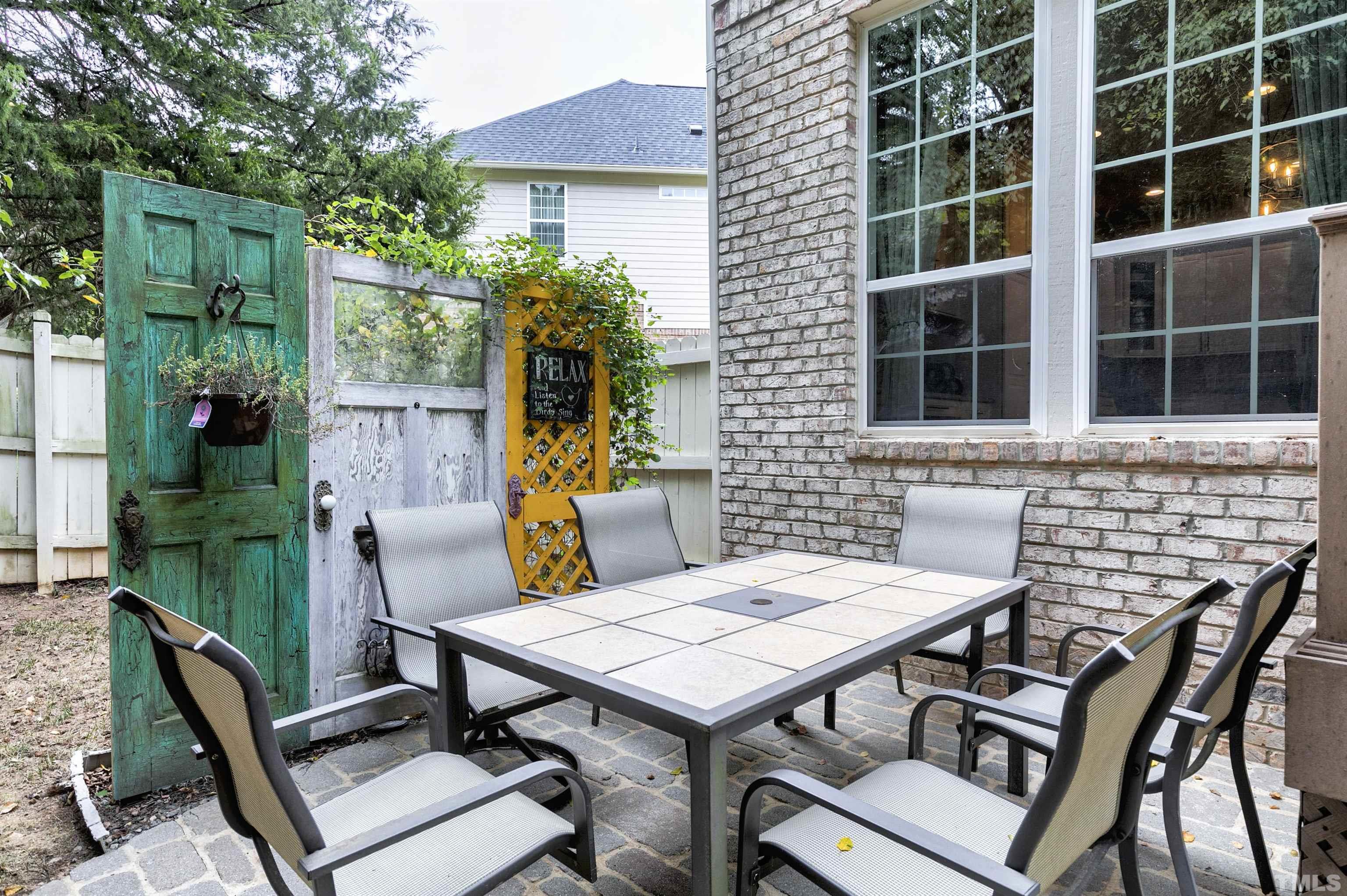 2255 Clayette Court Raleigh, NC 27612 - Photo 45 of 59 a view of a dinning table and chairs in patio