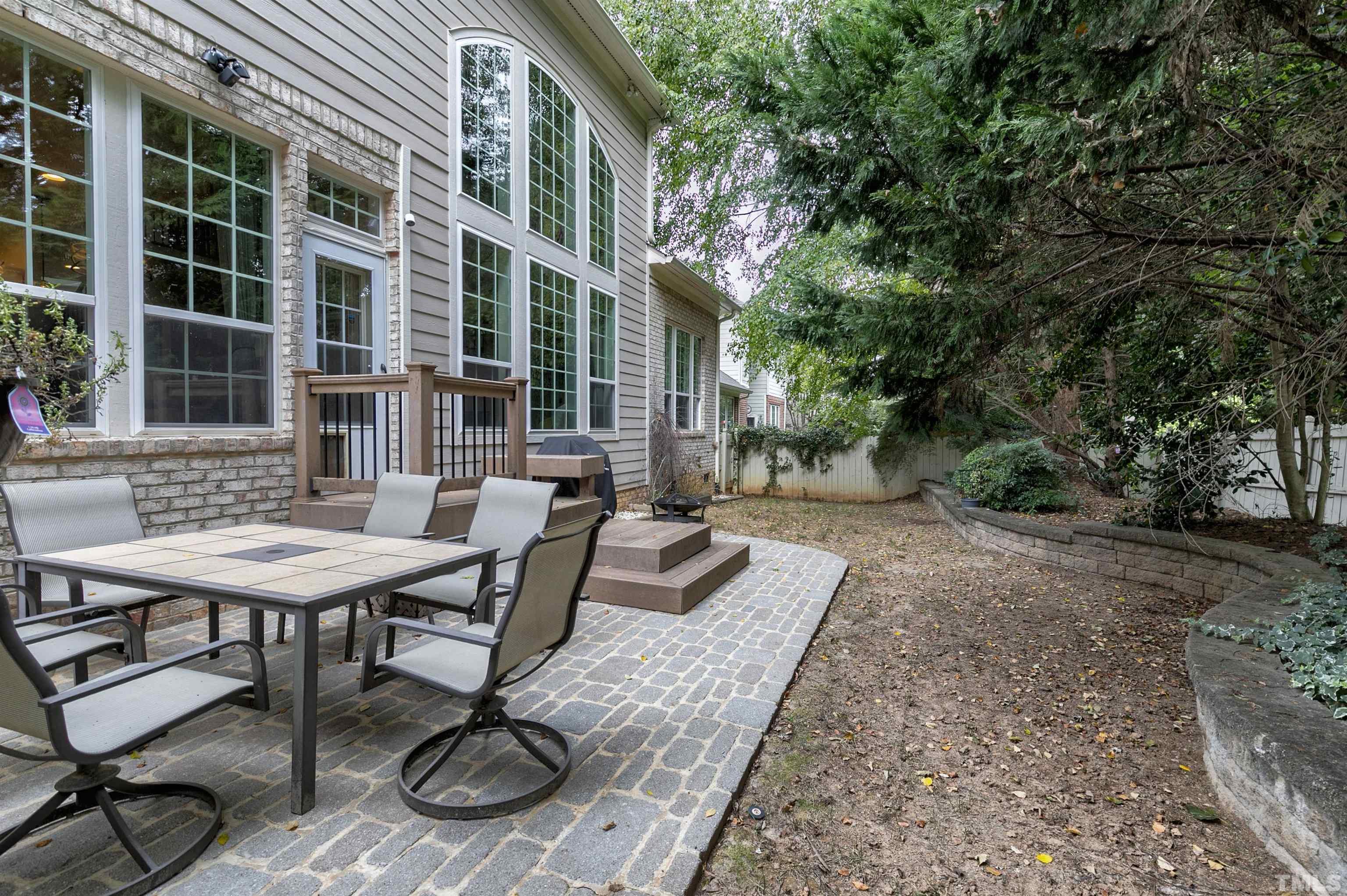 2255 Clayette Court Raleigh, NC 27612 - Photo 47 of 59 a view of a patio with table and chairs and potted plants