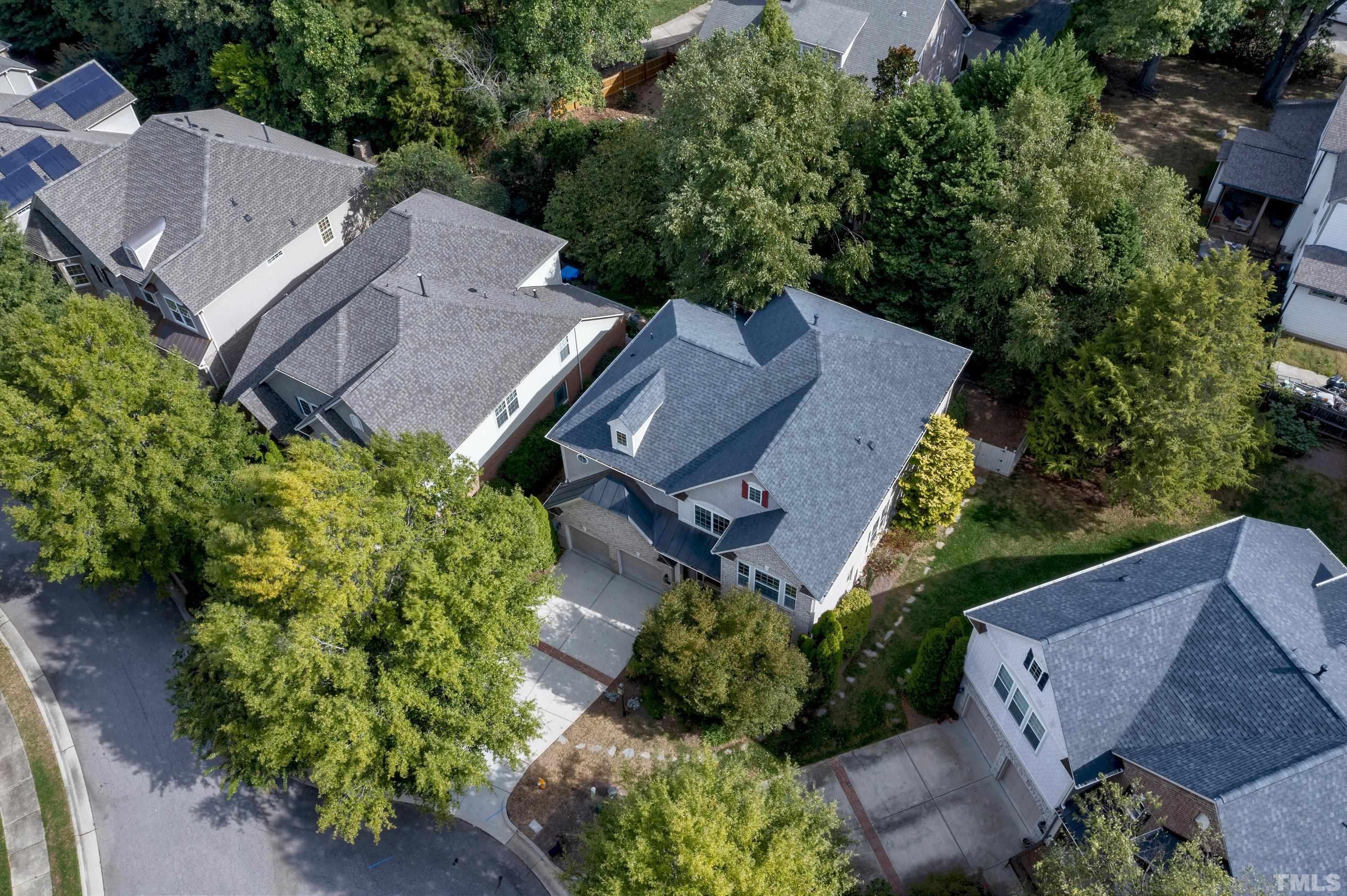 2255 Clayette Court Raleigh, NC 27612 - Photo 55 of 59 an aerial view of a house with garden space and street view