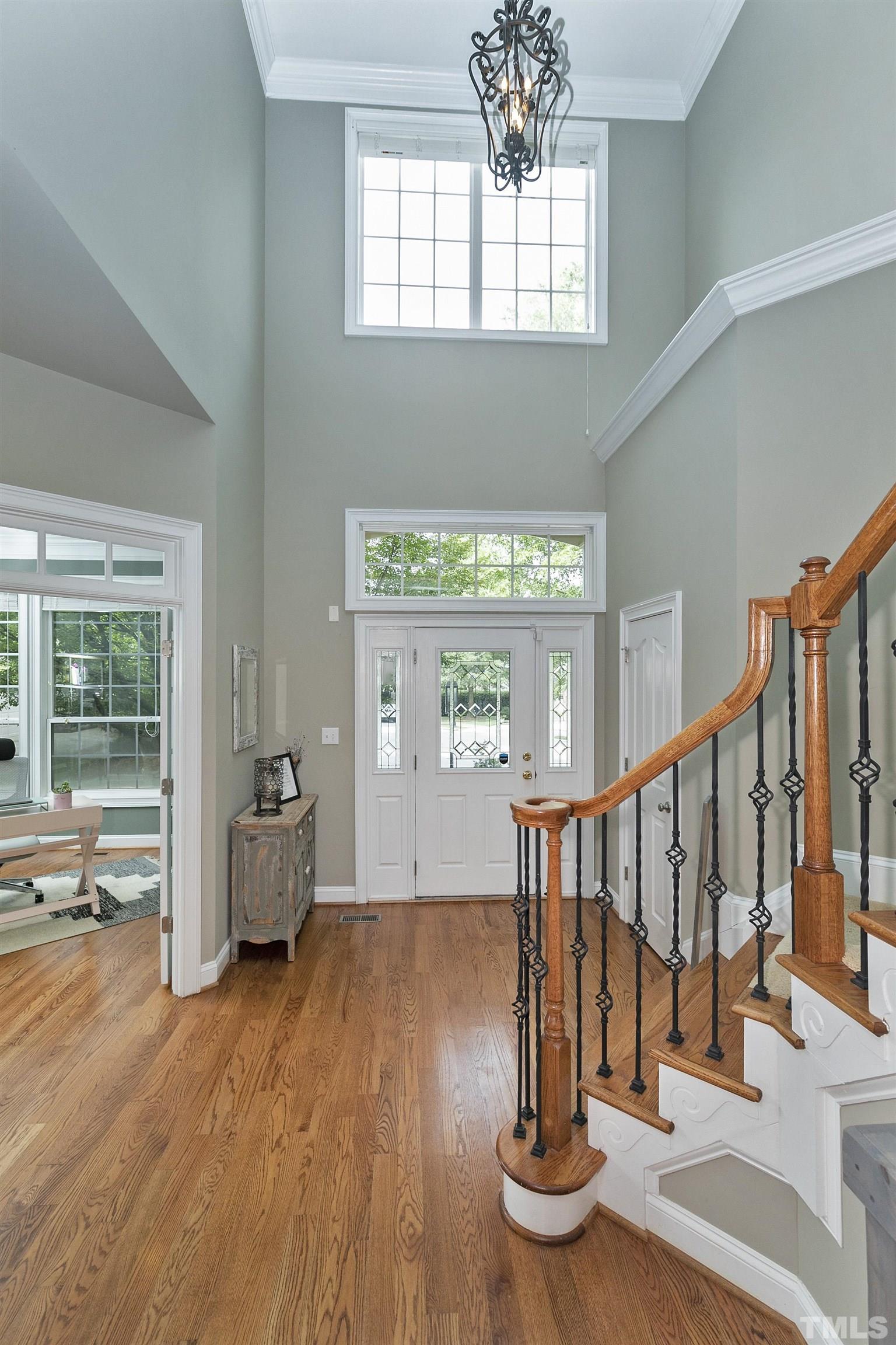 2255 Clayette Court Raleigh, NC 27612 - Photo 9 of 59 a view of entryway with wooden floor and front door