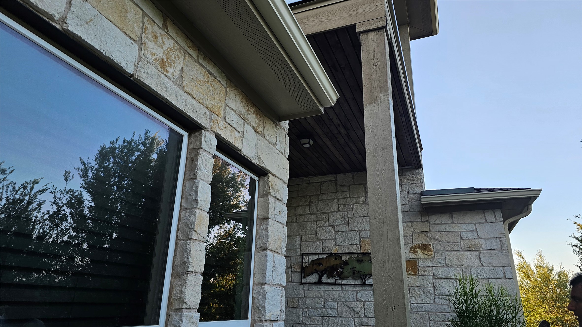 5821 Buchanan Draw Road Austin, TX 78738 - Photo 14 of 18 Natural stone construction with wide windows and a welcoming covered entry.