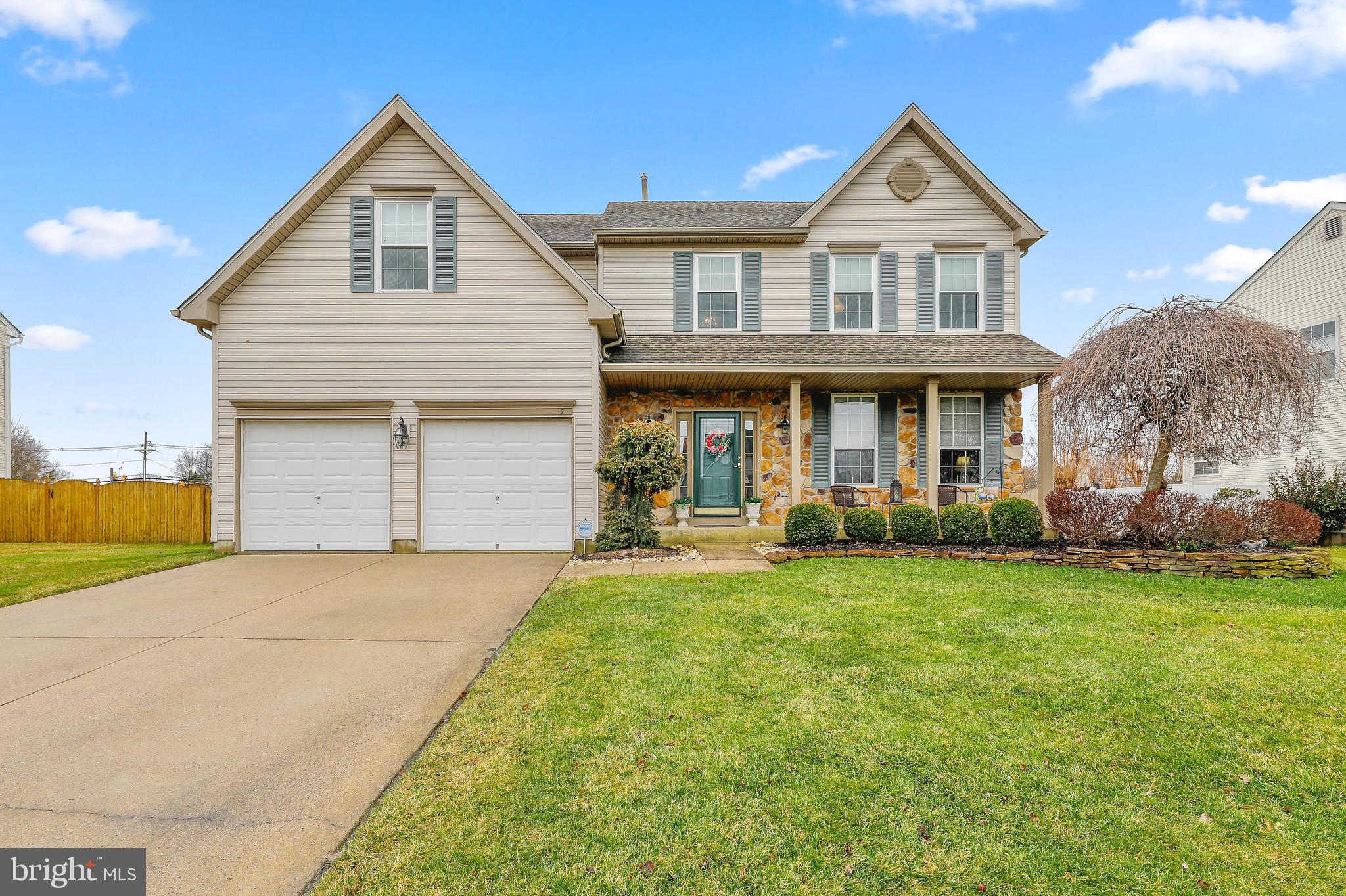 7 Colts Gait Road Evesham, NJ 08053 - Photo 1 of 47 a front view of a house with a garden and porch