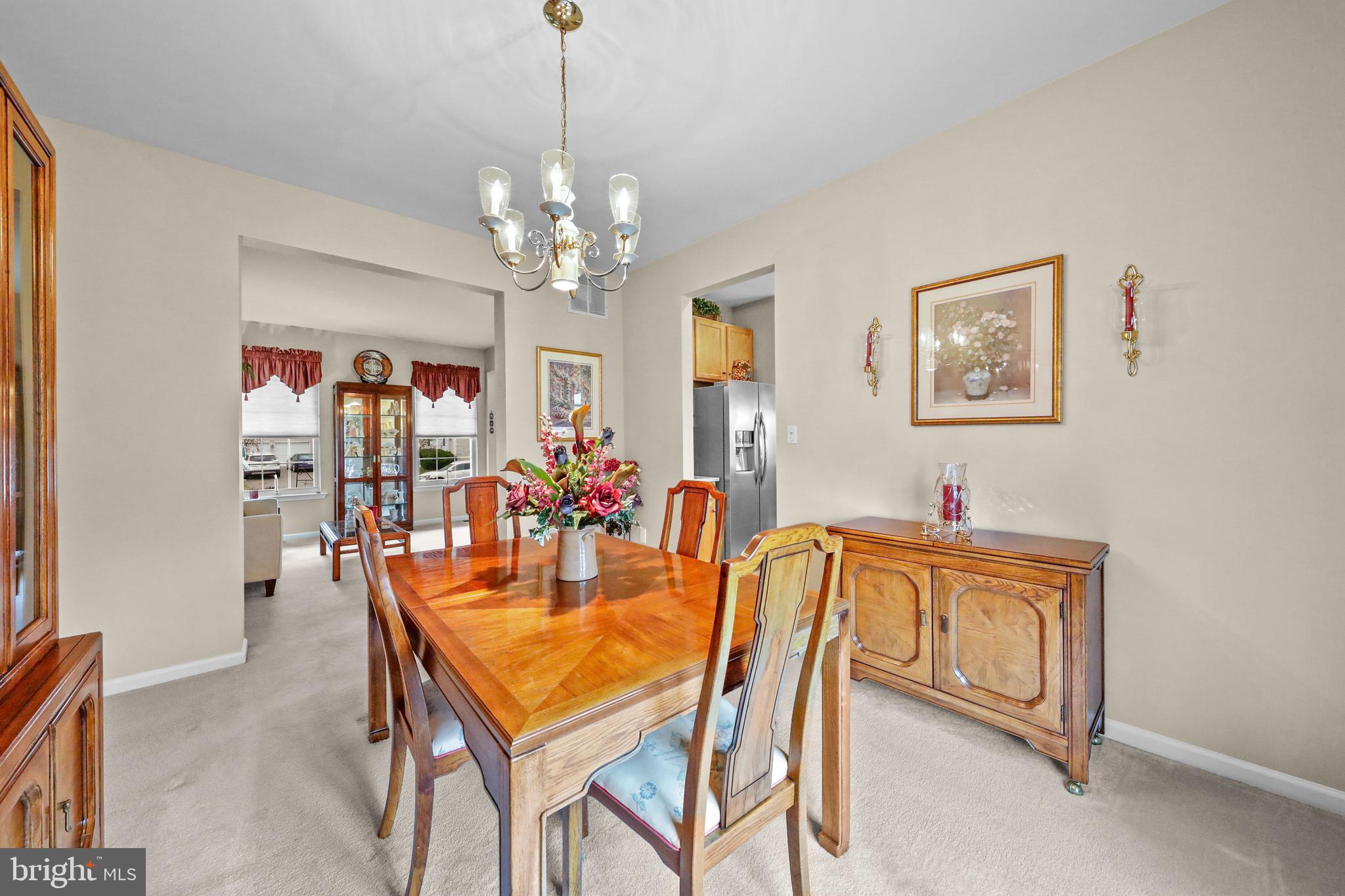 7 Colts Gait Road Evesham, NJ 08053 - Photo 15 of 47 a dining room with furniture and chandelier