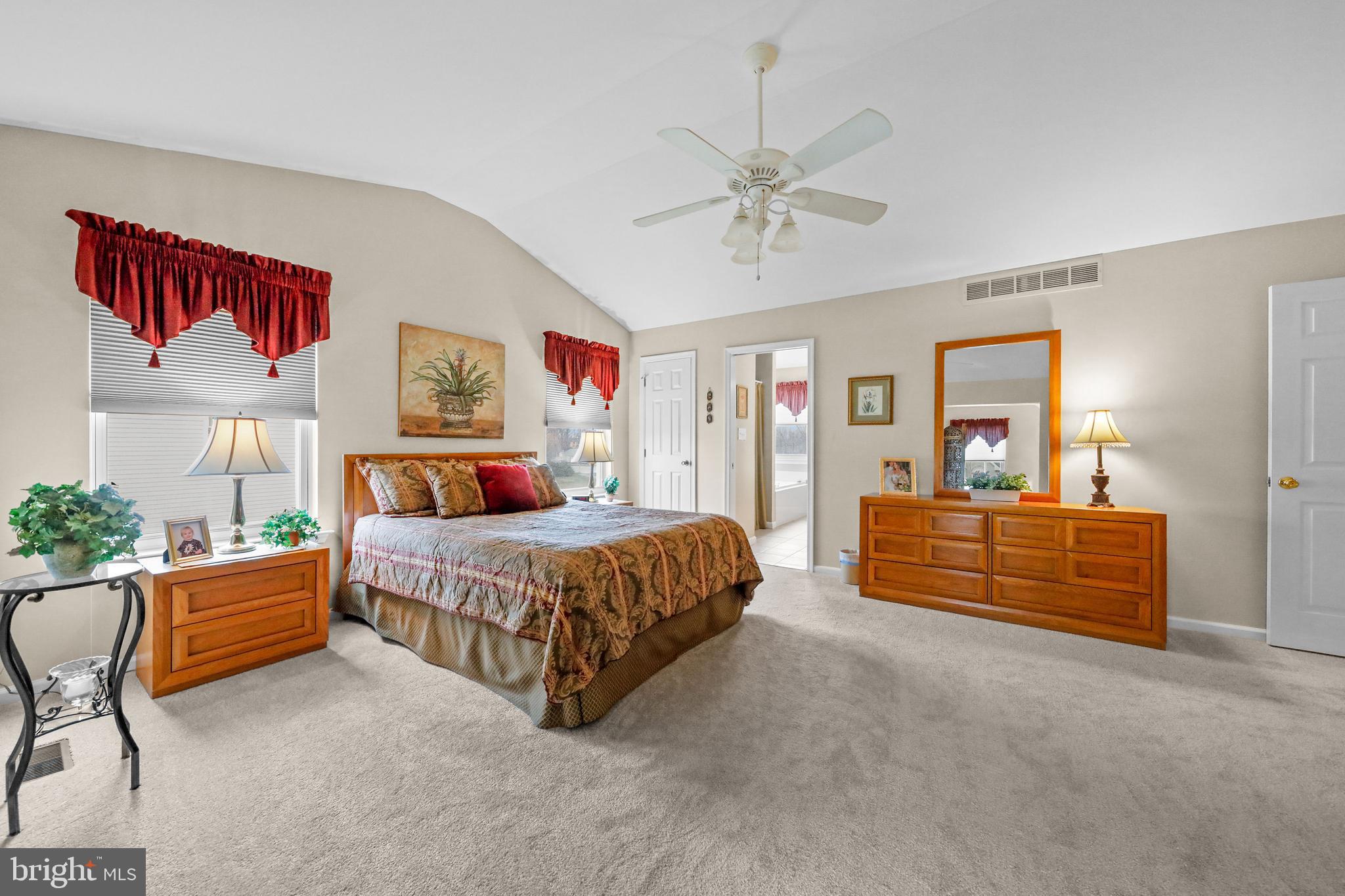 7 Colts Gait Road Evesham, NJ 08053 - Photo 23 of 47 a bedroom with a bed and a chandelier
