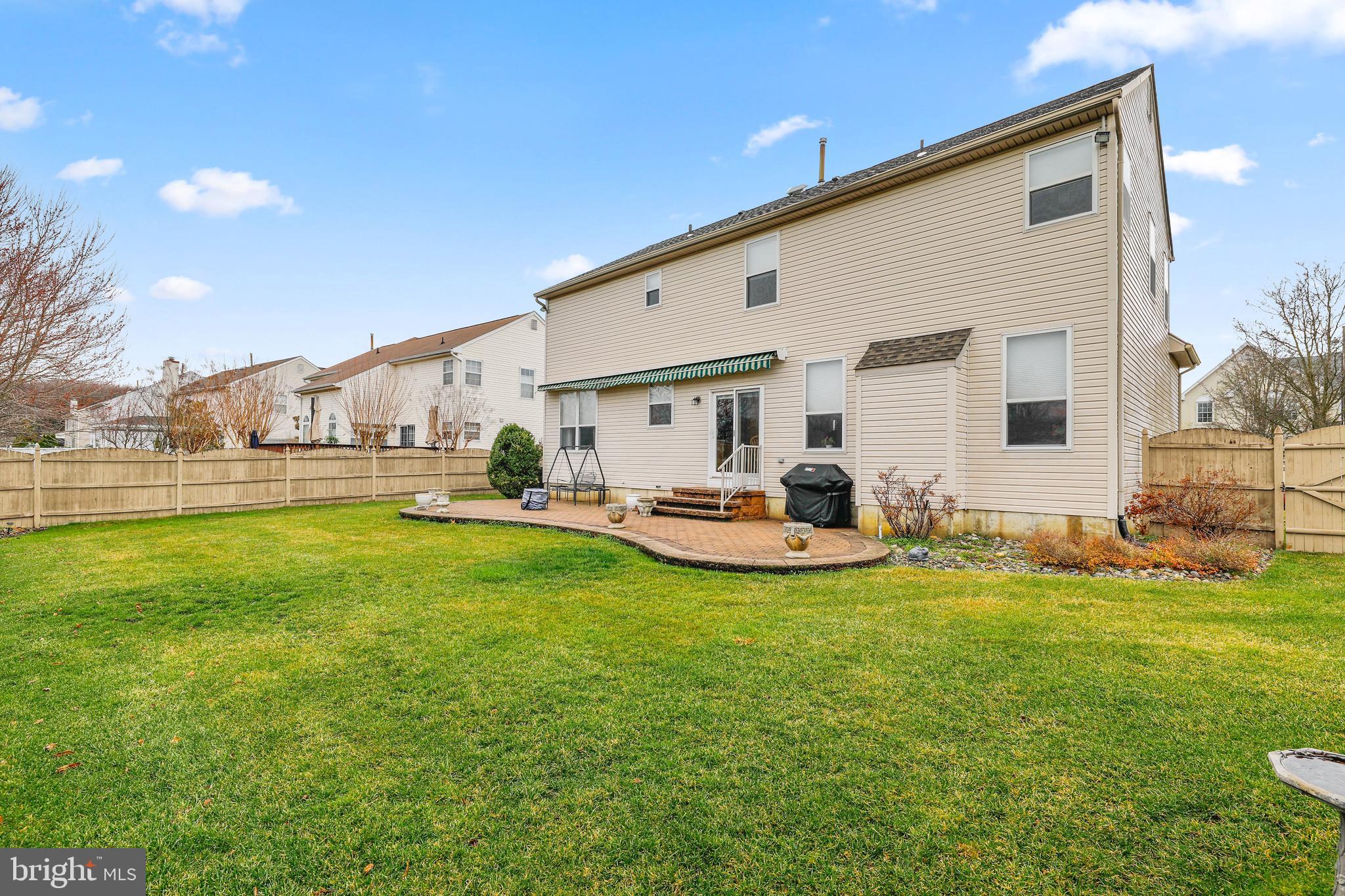 7 Colts Gait Road Evesham, NJ 08053 - Photo 36 of 47 a view of a white house with a big yard and sitting area