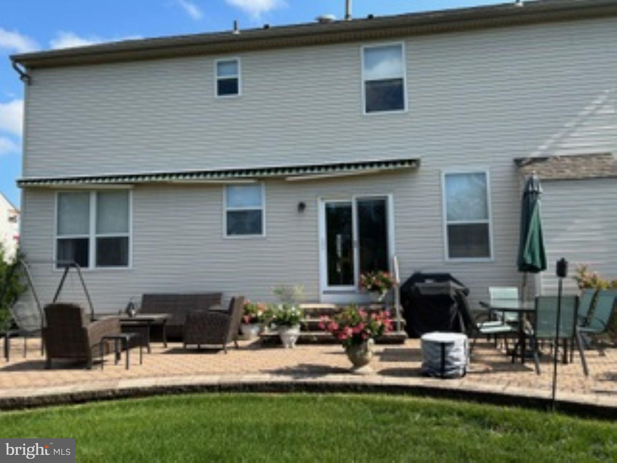 7 Colts Gait Road Evesham, NJ 08053 - Photo 43 of 47 a backyard of a house with table and chairs