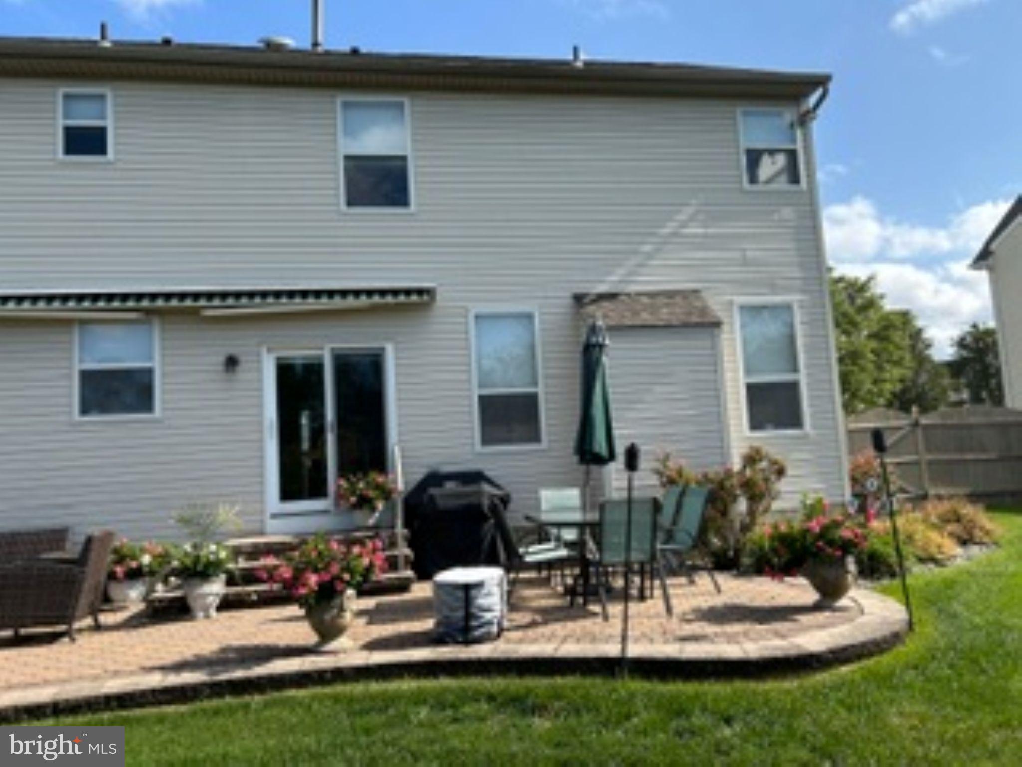 7 Colts Gait Road Evesham, NJ 08053 - Photo 44 of 47 a backyard of a house with a table and chairs