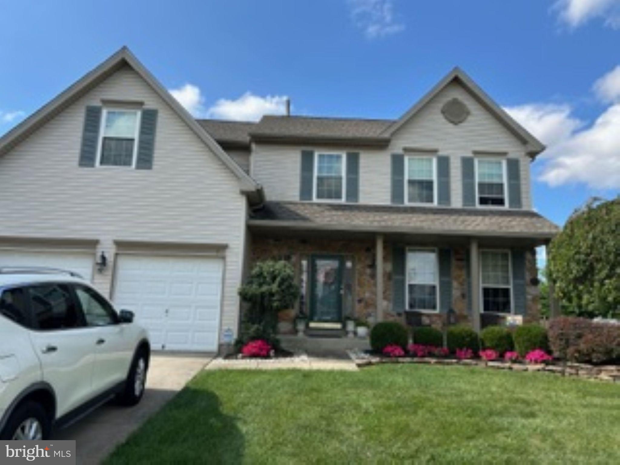 7 Colts Gait Road Evesham, NJ 08053 - Photo 46 of 47 a front view of a house with a yard and trees