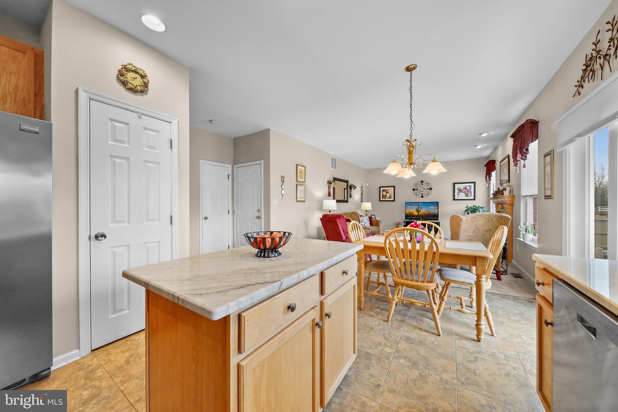 7 Colts Gait Road Evesham, NJ 08053 - Photo 8 of 47 a view of a dining room and livingroom with furniture wooden floor a chandelier
