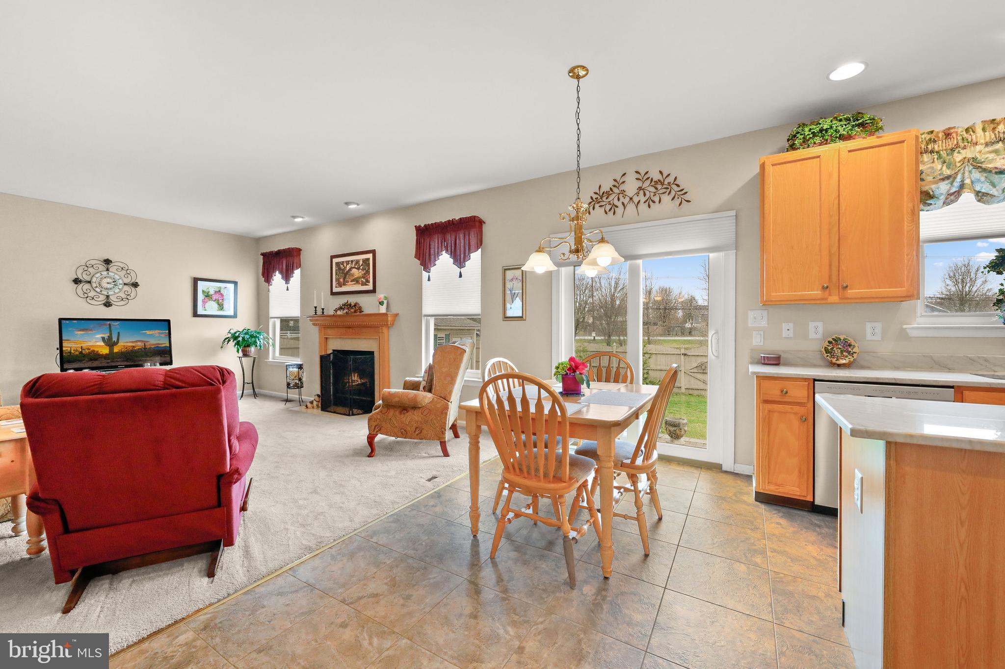 7 Colts Gait Road Evesham, NJ 08053 - Photo 10 of 47 a dining room with furniture a and a chandelier