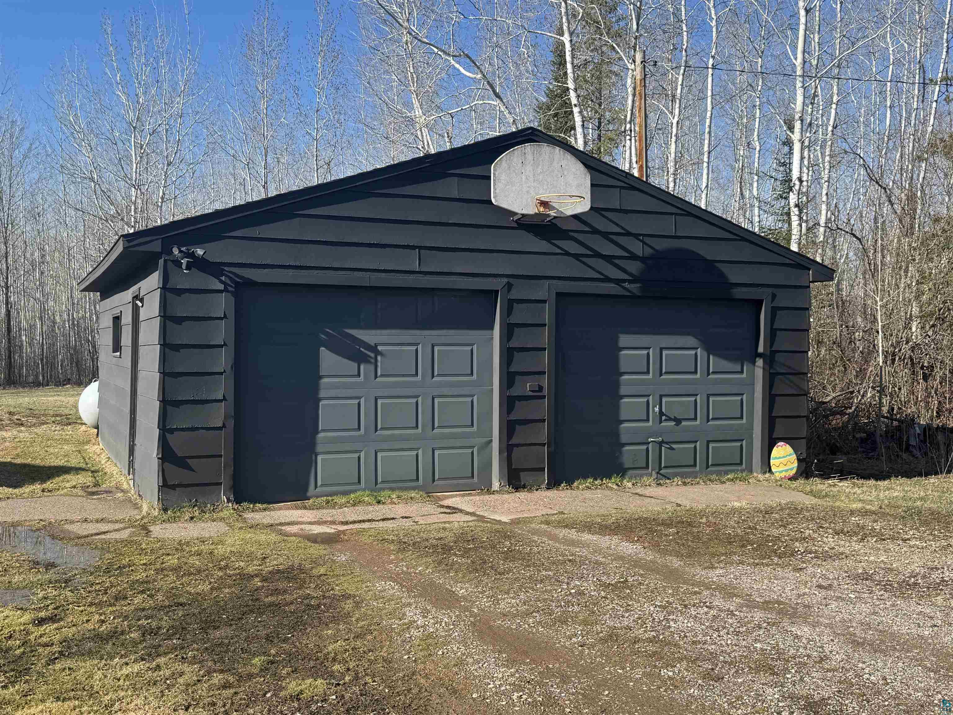 5133 East County Rd C Superior, WI 54880 - Photo 3 of 16 Garage featuring dirt driveway