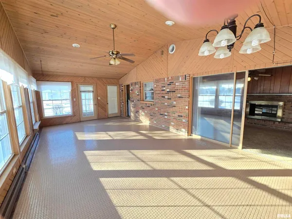 a view of a room window and wooden floor