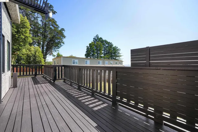 a view of balcony with wooden floor